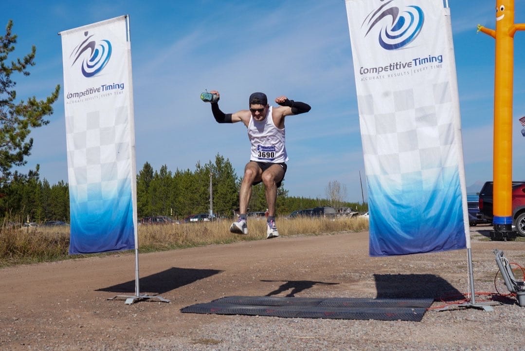 Drew Coco, hopping over the finish line to set the Le Grizz course record in 2021.